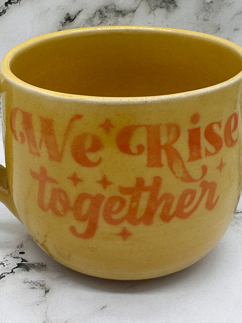 ‘We rise together’ Mug