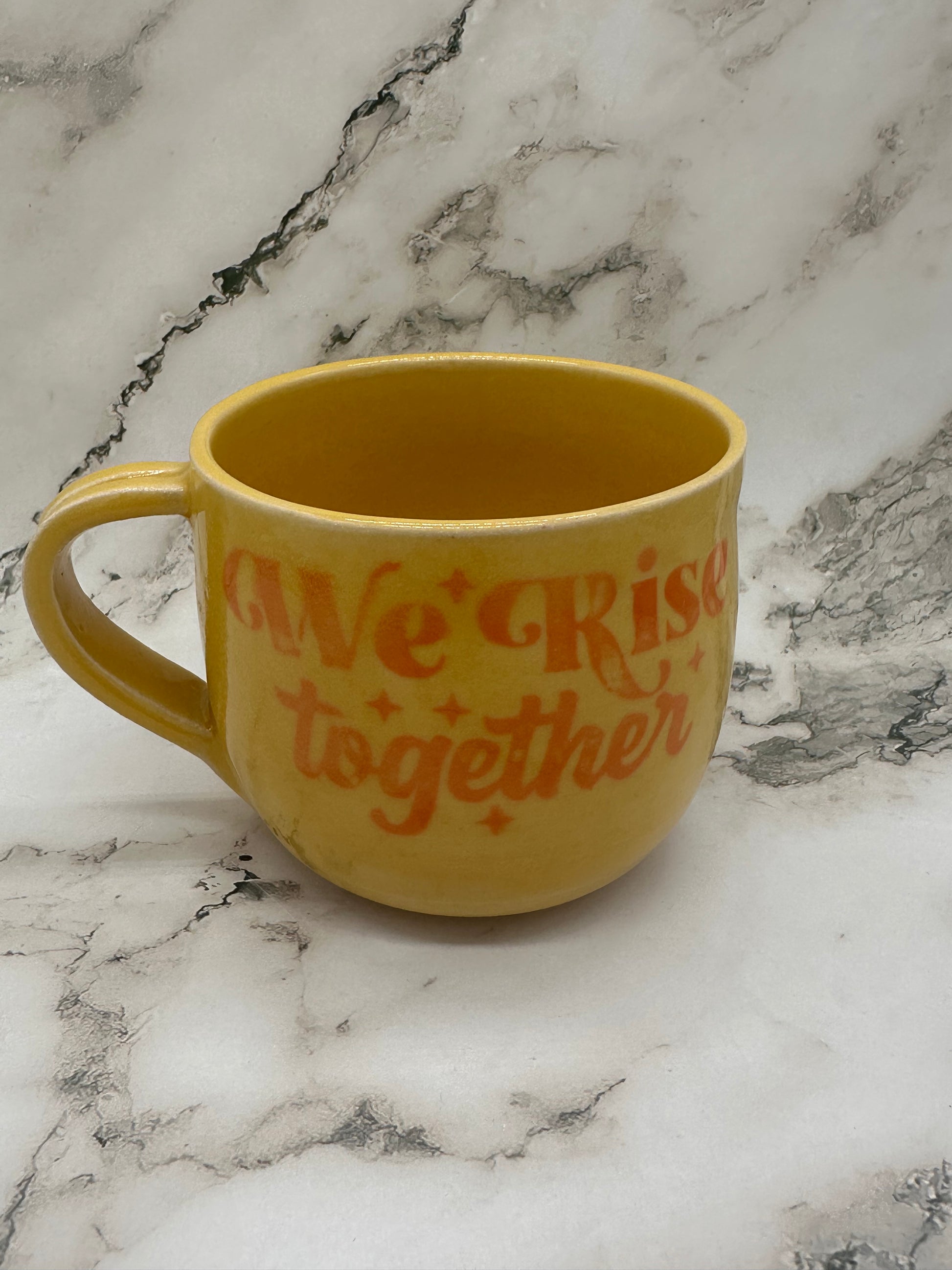 ‘We rise together’ Mug